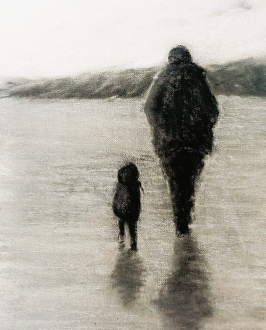 Adult and child in raincoats on a wet beach walking away with shadow on floor in black and white